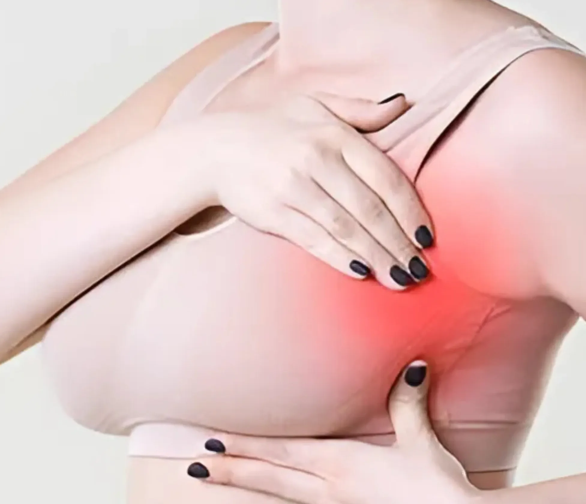 Woman experiencing breast pain and tenderness
